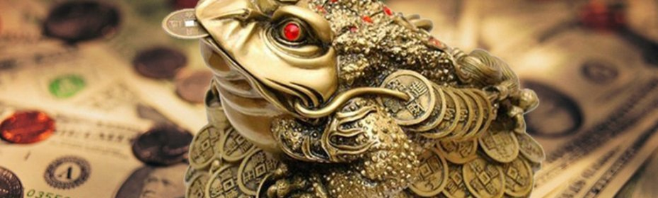 A toad with a coin in the mouth - a talisman to attract money